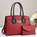 Detail of red lychee pattern handbag set with crossbody strap and silver square lock - Burgundy