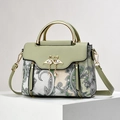 Green leather handbag with paisley pattern, gold swan clasp and pearl tassel on white stand - Khaki