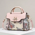Pink leather handbag with vintage paisley patterns and golden swan clasp detail - Off White