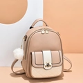 Fashionable beige leather backpack for women with bee buckle and pompom charm - Khaki & White Patchwork