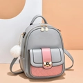 Pink and grey mini backpack for women featuring a gold bee buckle and quilted pocket - Grey and Pink