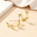 Elegant gold butterfly hoop earrings with frosted hollow design on warm background - Butterfly Style (E041) / Gold