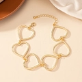 Polished gold hollow heart link bracelet with adjustable chain and lobster clasp closure - Gold Heart Bracelet