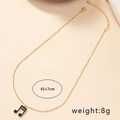 Collier doré avec pendentif note de musique en émail noir et blanc, longueur 45+7cm - Double Croche (X80-Musique)