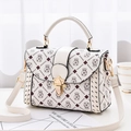 White monogram woven crossbody bag with HEBAOMANMAN print and gold metal lock clasp - Money Bag Style Off-white
