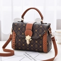 Brown retro printed crossbody bag with woven details and gold buckle closure - Money Bag Style Earthy Yellow