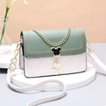 Green and beige crossbody bag featuring heart quilting and a cute cat-shaped clasp - Green Cover White Base