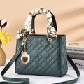 Dark green quilted handbag with silk scarf handle and elegant gold charms for women - Green