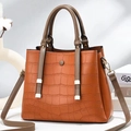 Orange-brown crocodile pattern tote bag with tassel detail and brown double handles - Earthy Yellow