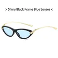 Occhiali da sole cat-eye con montatura nera, lenti blu e dettagli a nodo in metallo oro - Montatura nero lucido lente blu