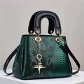 Deep green snakeskin textured crossbody bag with gold hardware and luxury star pendant - Green