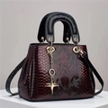 Deep purple snakeskin textured patent leather handbag with gold star pendant and strap - Red
