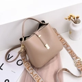 Khaki pebbled leather bucket bag with stylish patterned wide canvas strap and gold hardware - Khaki