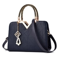 Dark blue V-patterned tote bag with golden metal hardware and woven handle - Dark Blue