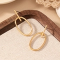Minimalist gold oval geometric earrings with T-bar pins displayed on a wooden tray - Gold