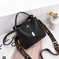 Black pebbled leather bucket bag with stylish jacquard wide strap on white platform - Black