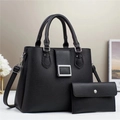 Detail of black lychee grain leather tote bag set with silver hardware and clutch - Black