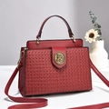 Elegant red woven handbag with gold horse head emblem and adjustable crossbody strap - Wine Red