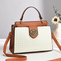 Brown and beige textured woven handbag with vintage metal buckle and adjustable strap - White