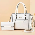 Detailed view of white faux leather tote set with lychee texture and golden logo accents - Beige