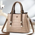 Detail of stone textured faux leather tote with brown handles and golden hardware - Khaki