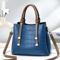 Large croc-embossed navy shoulder bag with brown tassels and spacious interior - Blue