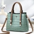 Mint green crocodile embossed tote bag with brown handles and golden hardware detail - Green
