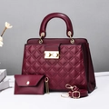 Close-up of wine red quilted PU leather tote bag with gold metal twist lock and strap - Burgundy