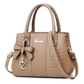 Brown lychee leather tote bag with braided texture and heart bow charm detail - Khaki