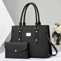 Detail view of black faux leather tote set including handbag and matching clutch bag - Black