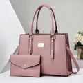 Close-up of pink PU leather tote bag set including a clutch and gold metal hardware - Pink