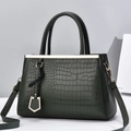Dark green stone-patterned trapezoid handbag with gold metal accents and shoulder strap - Dark Green