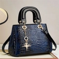 Glossy navy crocodile embossed handbag with gold star charm and black top handles - Blue