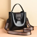 Minimalist black bucket bag with contrast brown flap and striped web shoulder strap - Black