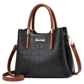 Close-up of black crocodile texture leather and gold hardware on large tote bag - Crocodile Pattern Black