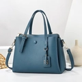 Minimalist grey-blue lychee grain crossbody bag with top handle and gold hardware detail - Blue