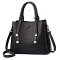 Black pebbled leather tote bag with contrast fringe details and adjustable shoulder strap - Black