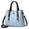 Light blue and brown textured leather handbag with fringe details and crossbody strap - Blue