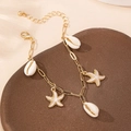 Golden ocean charm bracelet with white sea shells and starfish for beach vacation style - Pearl White Starfish (5505944745552)