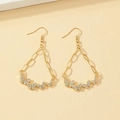 Golden butterfly drop earrings with sparkling rhinestones and crystal tassel design - Gold