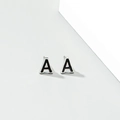 Minimalist silver-tone letter A stud earring with black enamel finish and soft shadows - Letter A