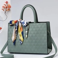 Green embossed faux leather handbag with colorful silk scarf and gold buckle detail - Green