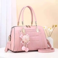 Pink quilted tote bag with textured faux leather, pompom charm, and top handles - Pink
