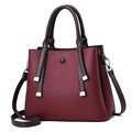 Deep red pebbled leather satchel with contrast straps and silver metal tassel detail - Burgundy