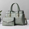 Detail of stone pattern texture on light green tote bag and matching envelope wallet - Green