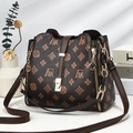 Vintage monogram bucket bag in brown leather with gold hardware and side zipper detail - FAK Monogram