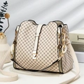 Detail of minimalist bucket bag featuring contrast geometric patterns and gold chain - Off-white