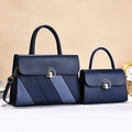 Navy blue faux leather tote set with light blue stripes and round gold buckles - Blue