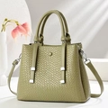 Olive green woven texture tote bag with crossbody strap on a minimalist background - Green