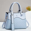 Elegant light blue textured tote bag with woven leather pattern and adjustable shoulder strap - Blue